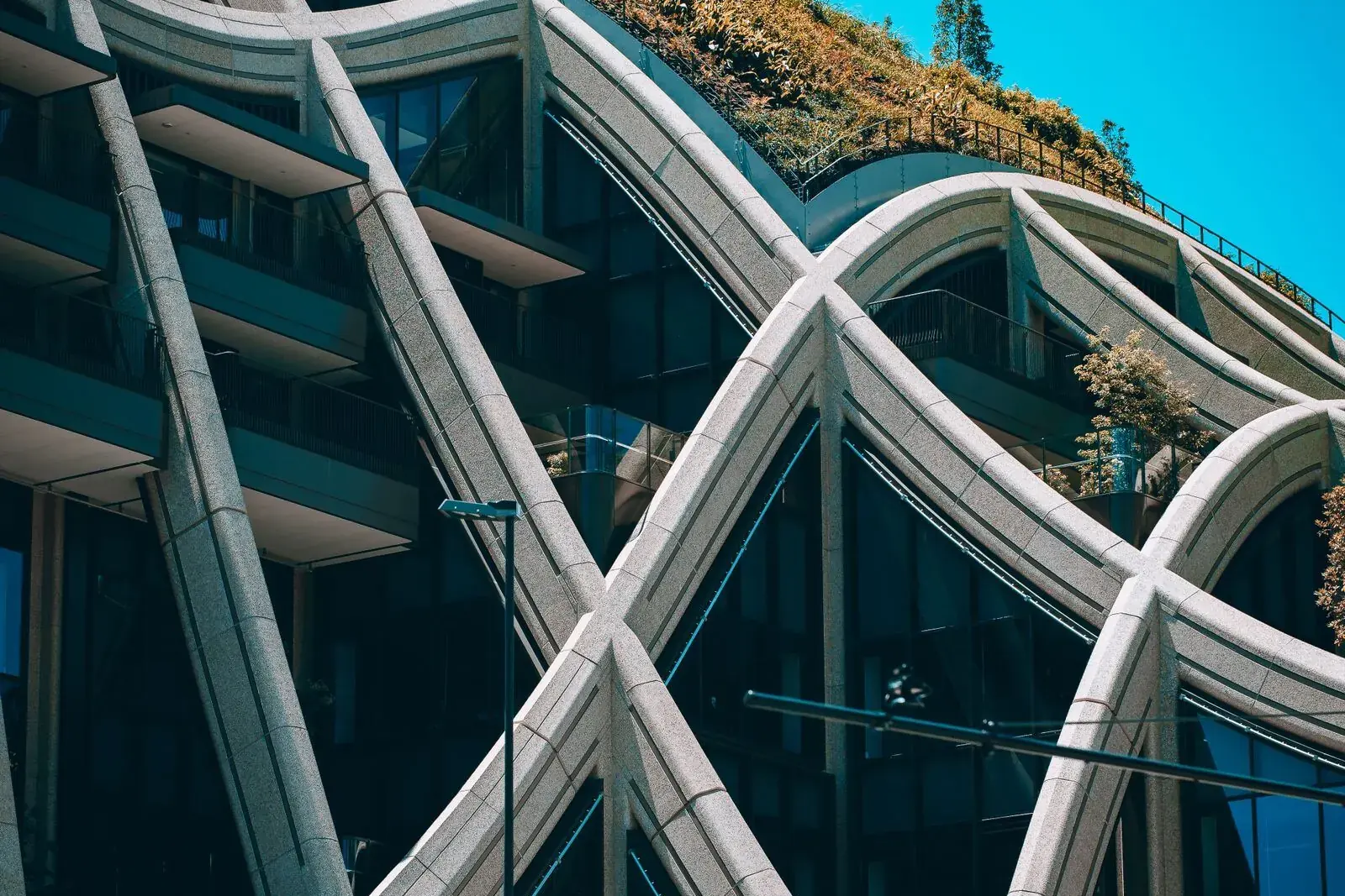 Modern building in Tokyo with curving structure and green roof