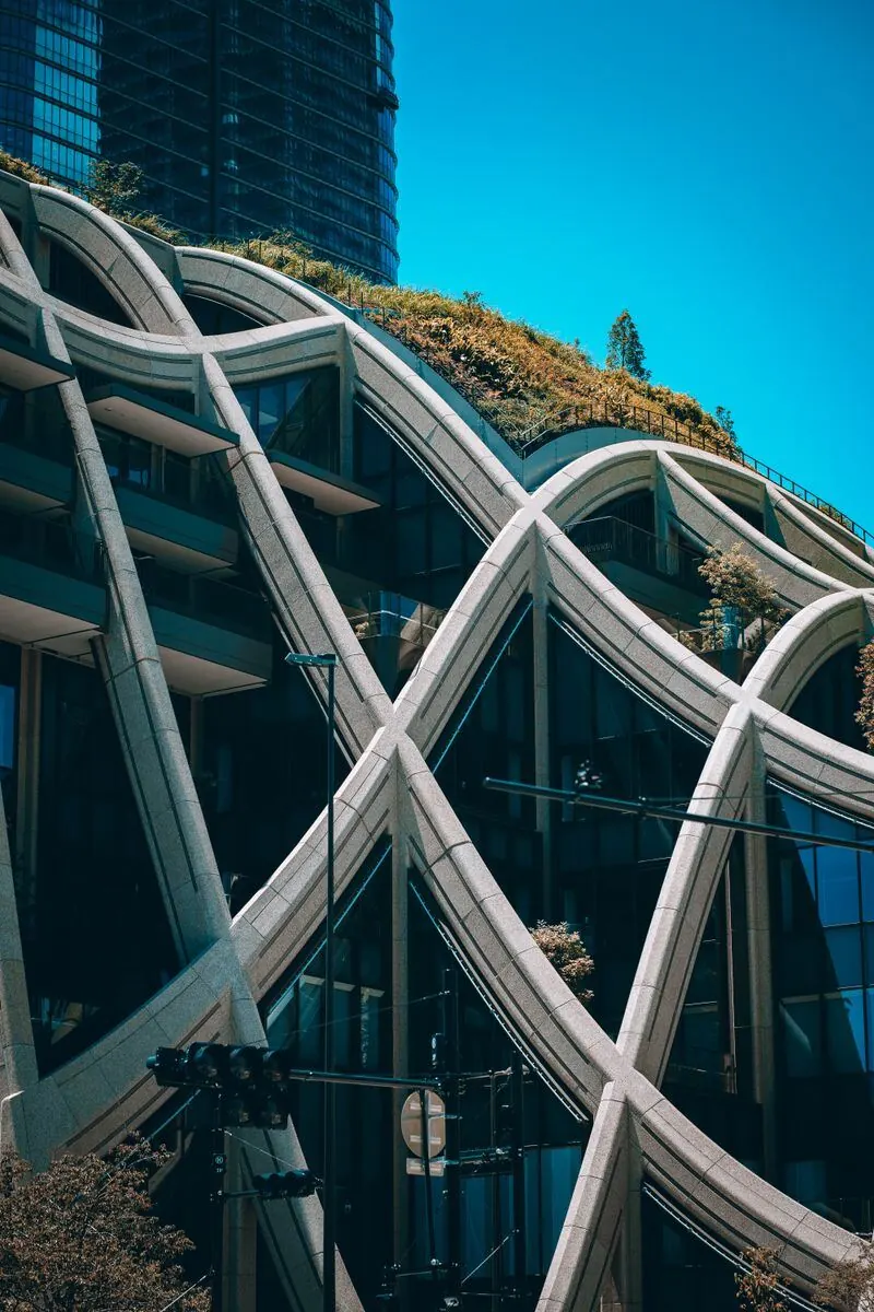 Modern building in Tokyo with curving structure and green roof