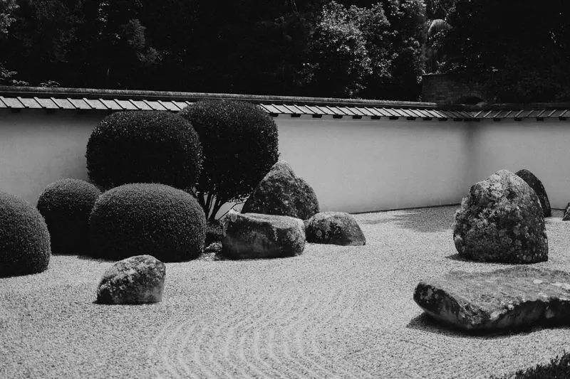 Raked gravel and rocks in a Zen garden in Kyoto
