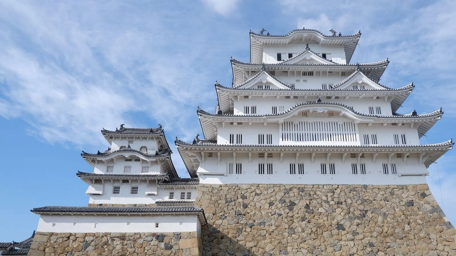 The main keep rises above its curved stone base