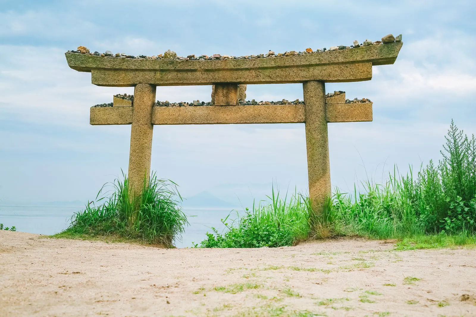 A torii gate on a beach on Naoshima