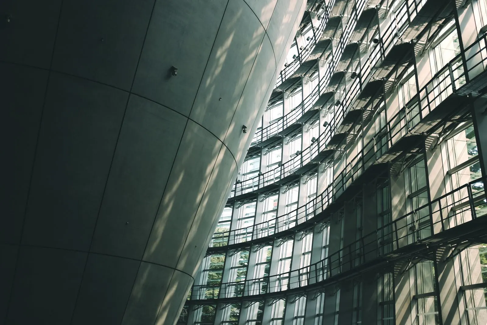 Glass façade and concrete cone of the museum in Roppongi